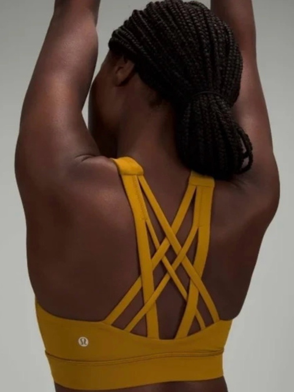 lululemon athletica Free To Be Elevated Women's Strappy Sports Bra. Gold Spice
